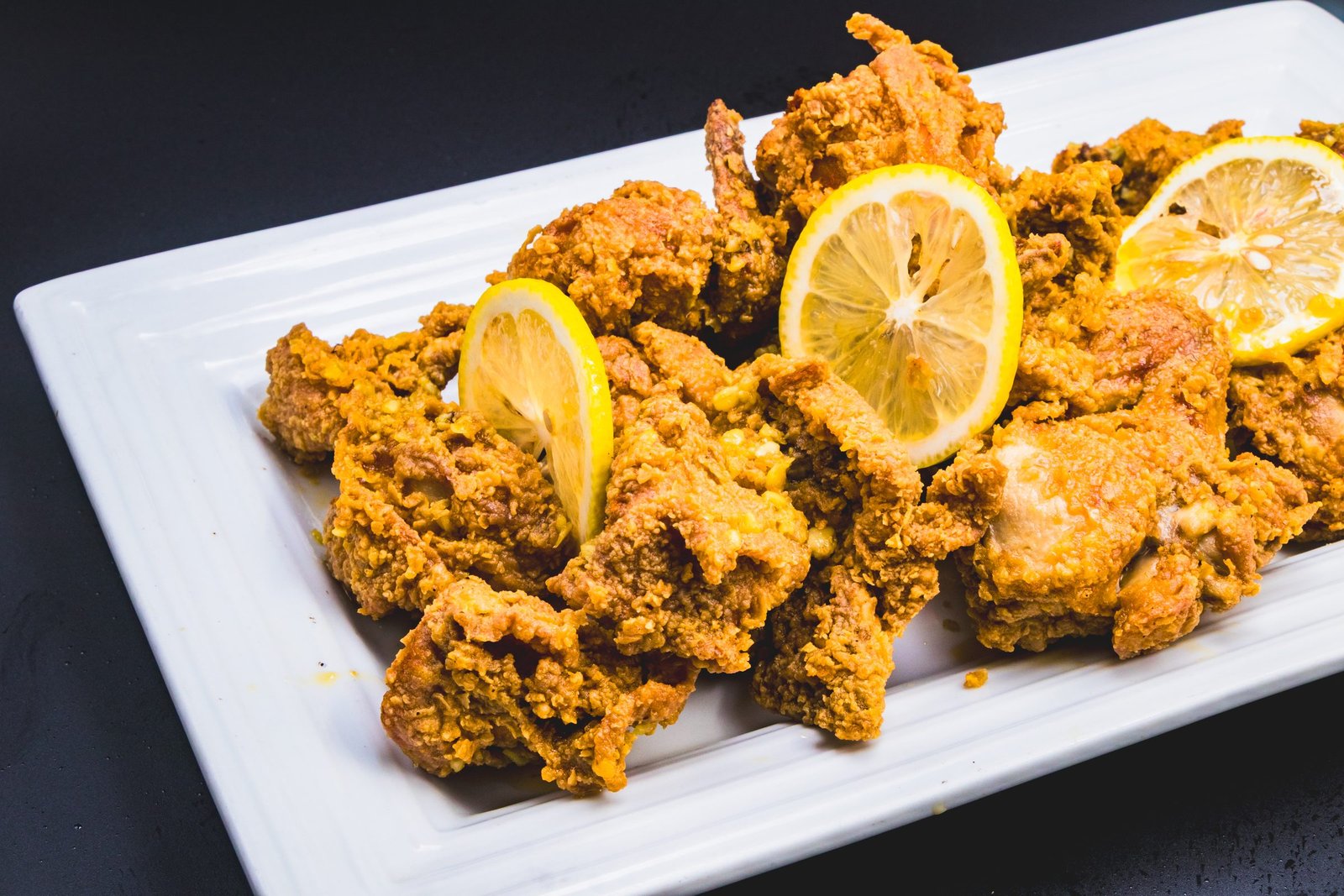 Crispy fried chicken with lemon slices