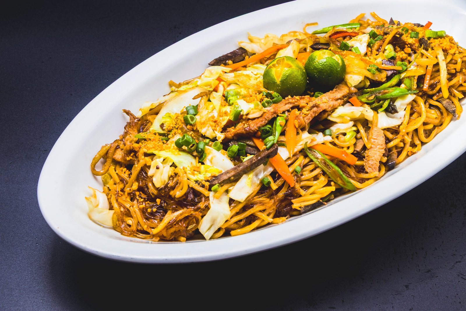 Pancit canton with vegetables and calamansi
