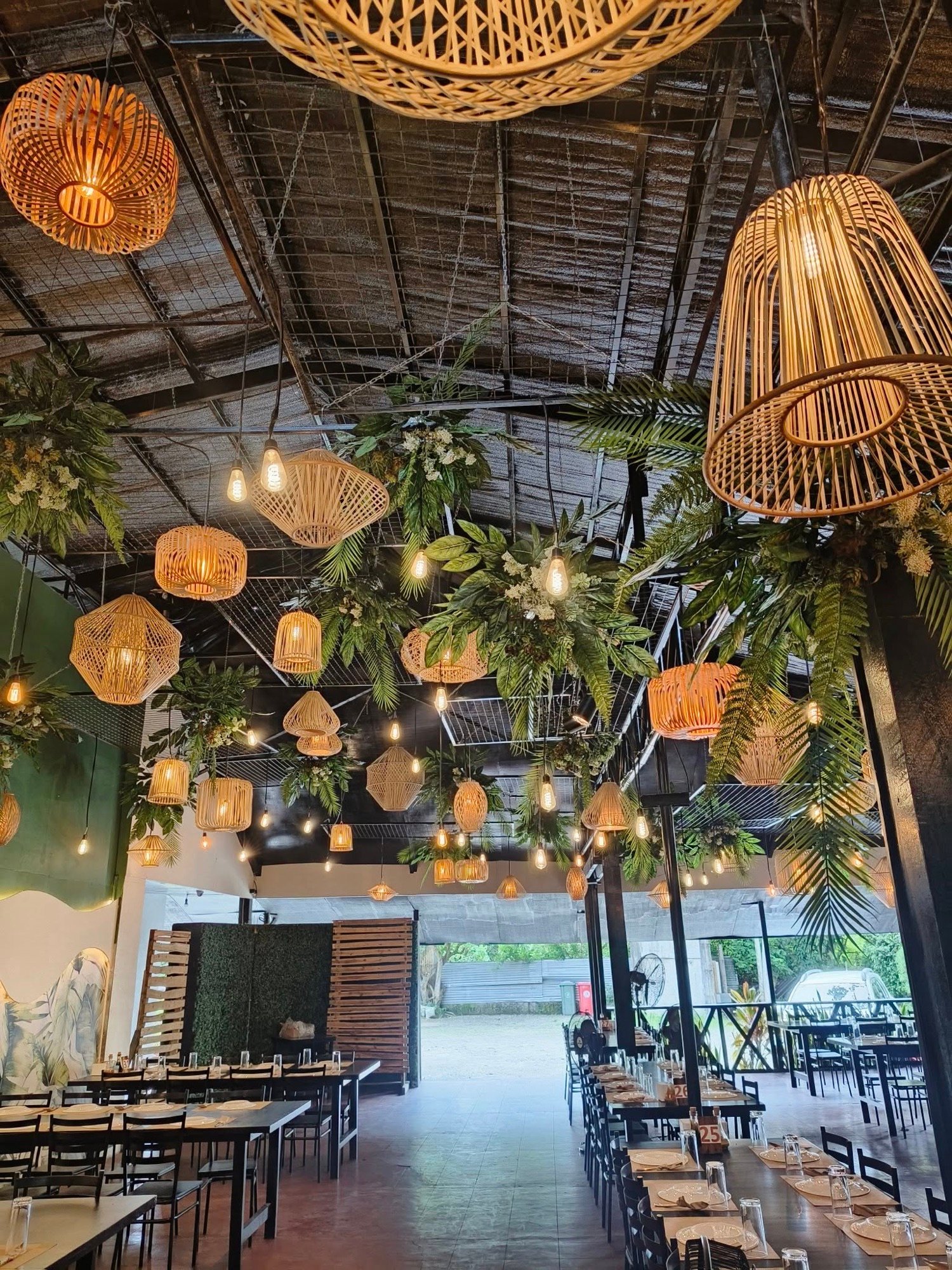 Rattan lamps over the dining room at night