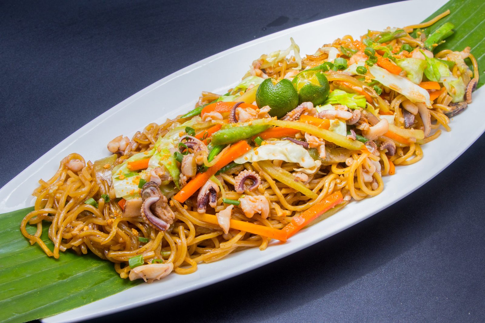 Seafood pancit canton with squid, carrots and calamansi